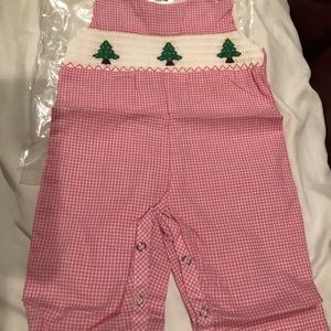 One piece NWT PINK 0-3mo boutique style outfit. Smocked front. Still in plastic.